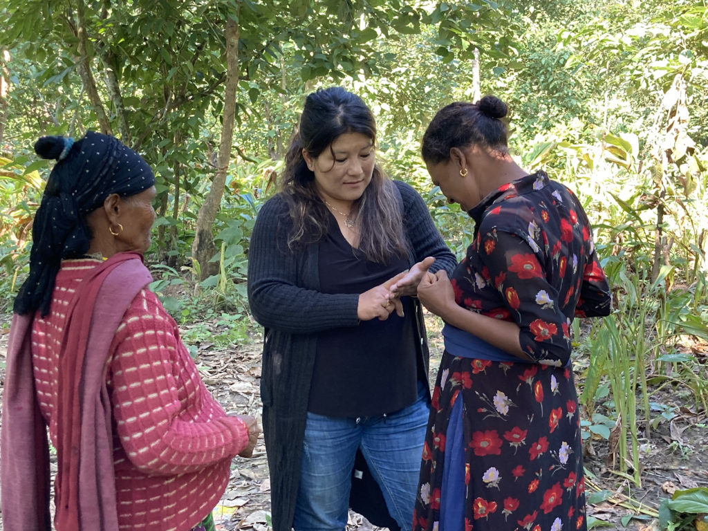 Sulechana meeting with members of a physically challenged community that hopes to grow organic turmeric for Organic Valley.